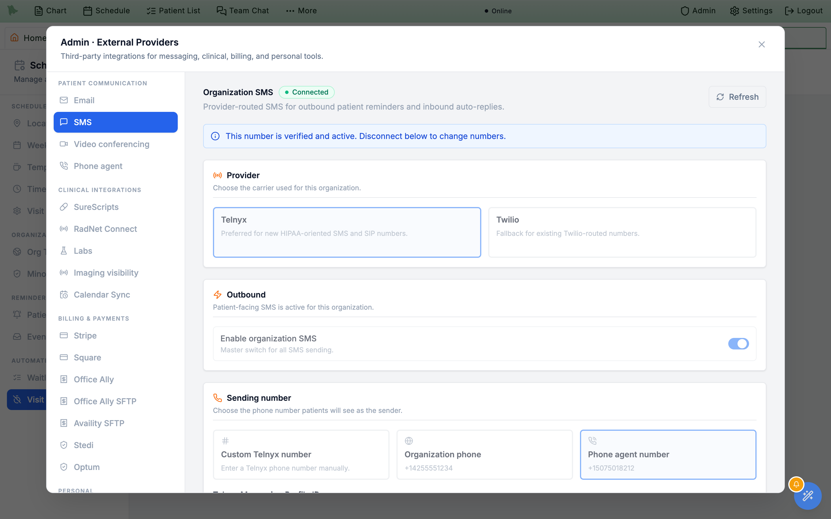 Organization SMS tab with a Provider card offering Telnyx and Twilio, Custom number, Organization phone, and Phone agent number options, an Inbound auto-replies card, and a Verify number & configure webhook button